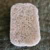 Close-Up of Beige Soap Saver Pad with Textured Surface for Soap Drainage